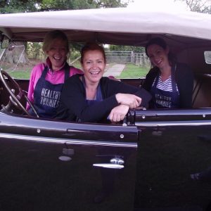 Photograph of Healthy Yummies team members in a car.