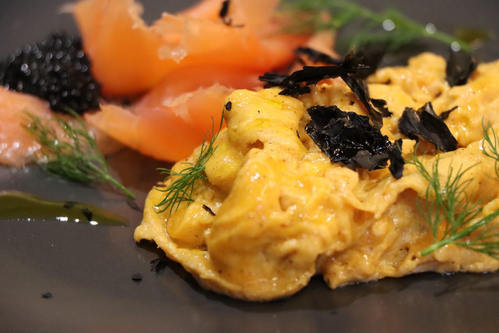 Scrambled Eggs with Smoked Salmon on a grey plate