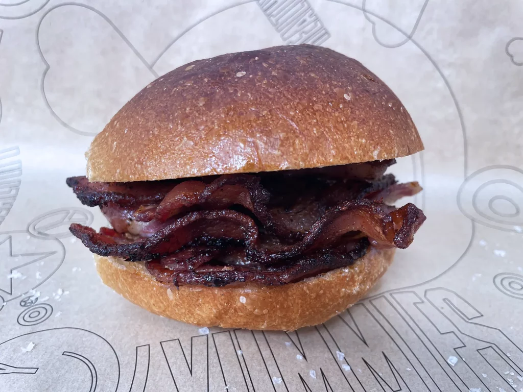 Photograph of a bacon roll.